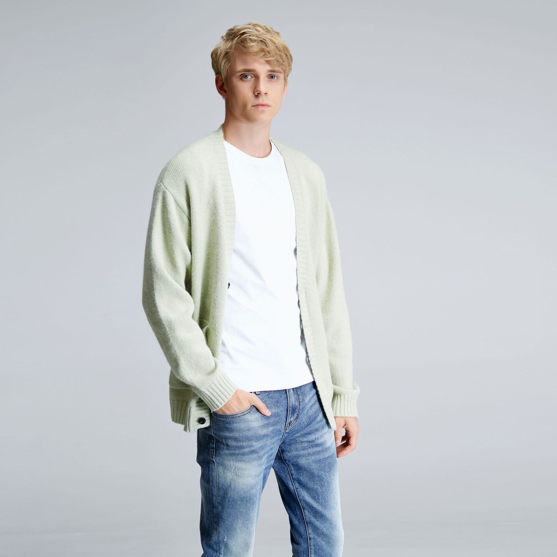 Men's mint green relaxed cardigan layered over white T-shirt