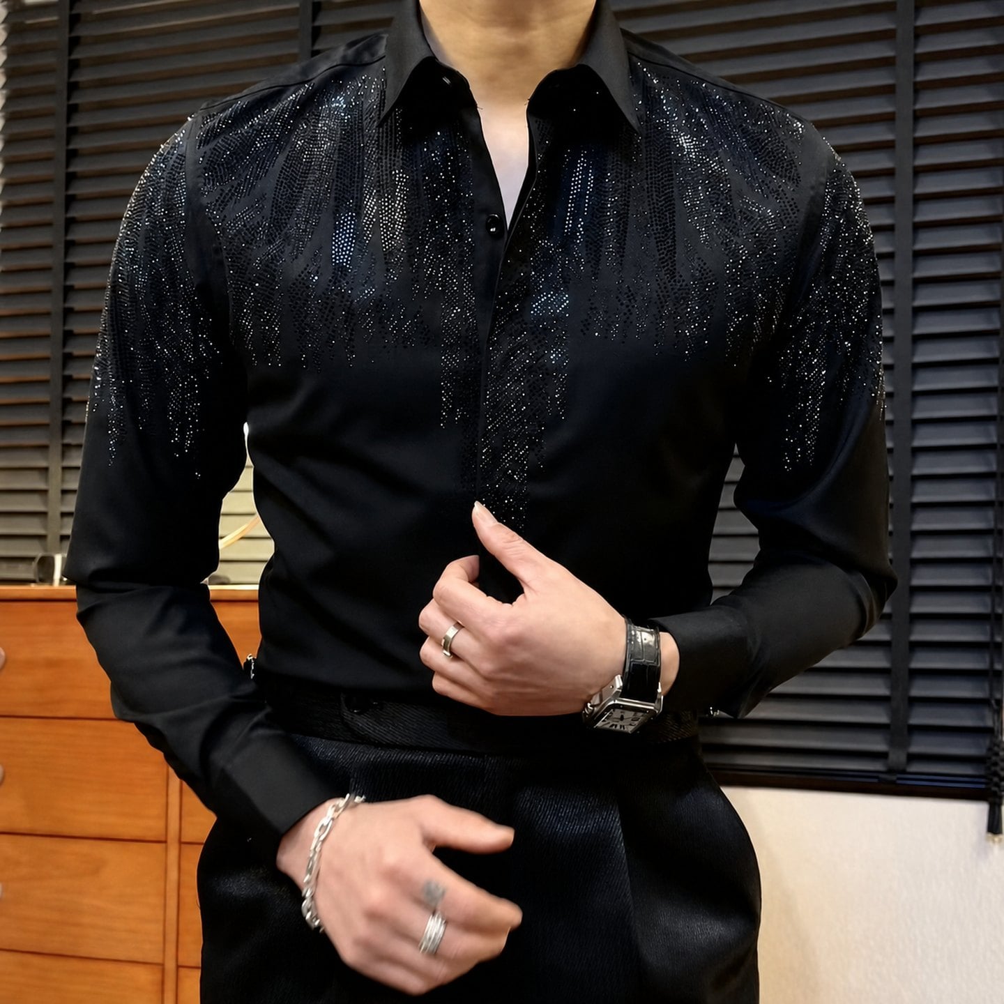 Men's Wing Rhinestone Slim Fit Shirt 13 Man wearing a black wing rhinestone slim fit shirt under stage lighting