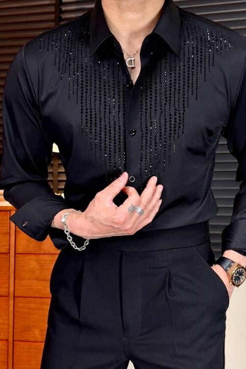 Male model wearing a black rhinestone embellished long sleeve dress shirt