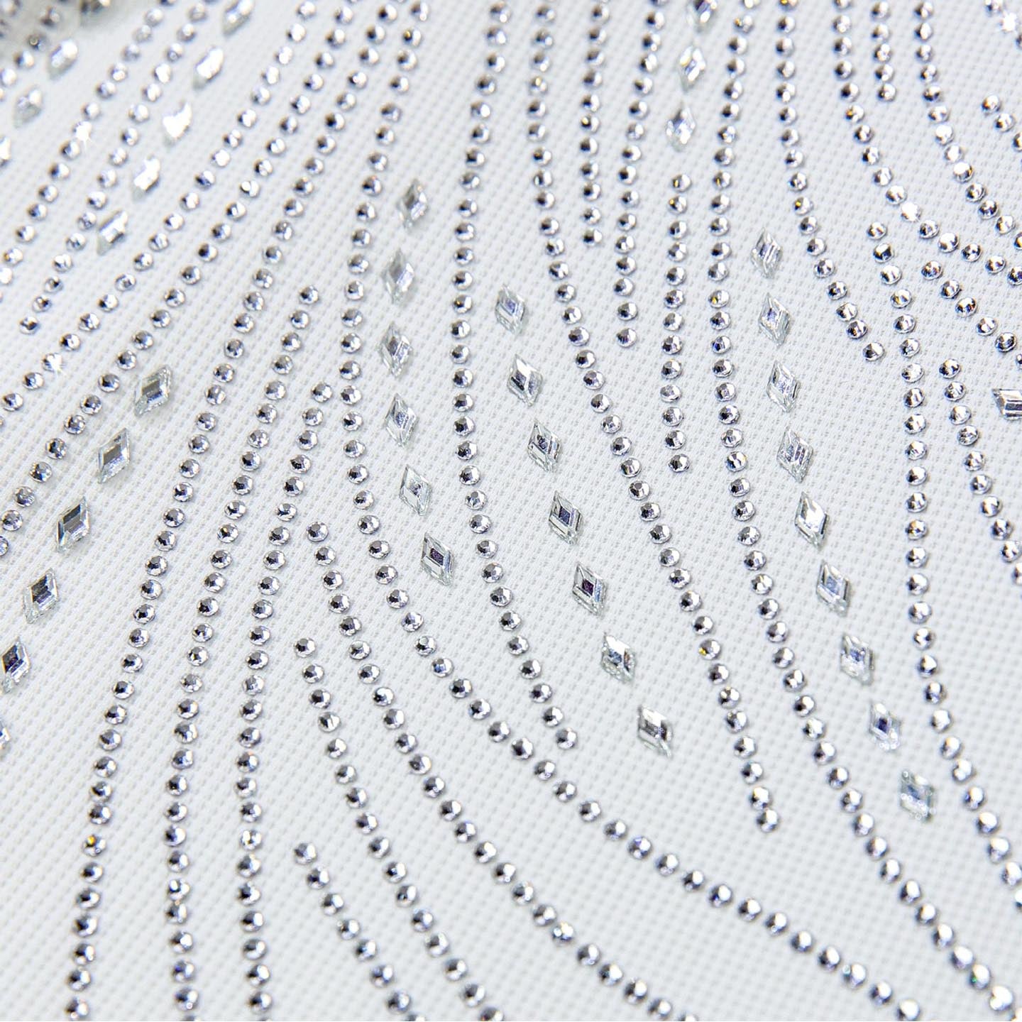 Close-up of the white rhinestone performance shirt design