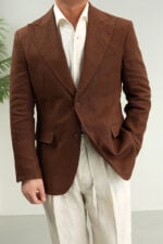 Coffee brown linen blazer worn with white shirt and light trousers