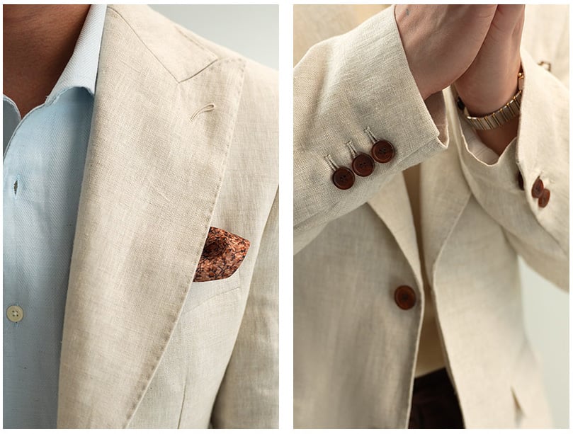 Detail view of natural beige linen blazer peak lapel and sleeve buttons