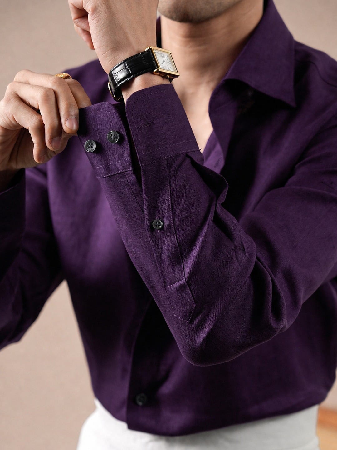 Men's Spread Collar Linen Shirt 9 Close-up of the rounded button cuffs and purple linen texture